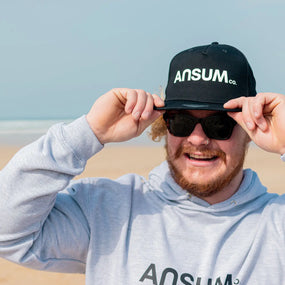 Ansumco. Snapback Cap - Black Ansumco.